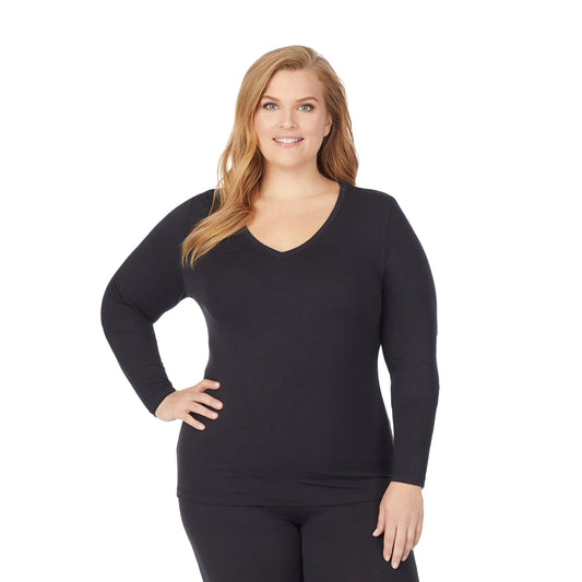 upper body of a lady wearing black long sleeve v-neck top