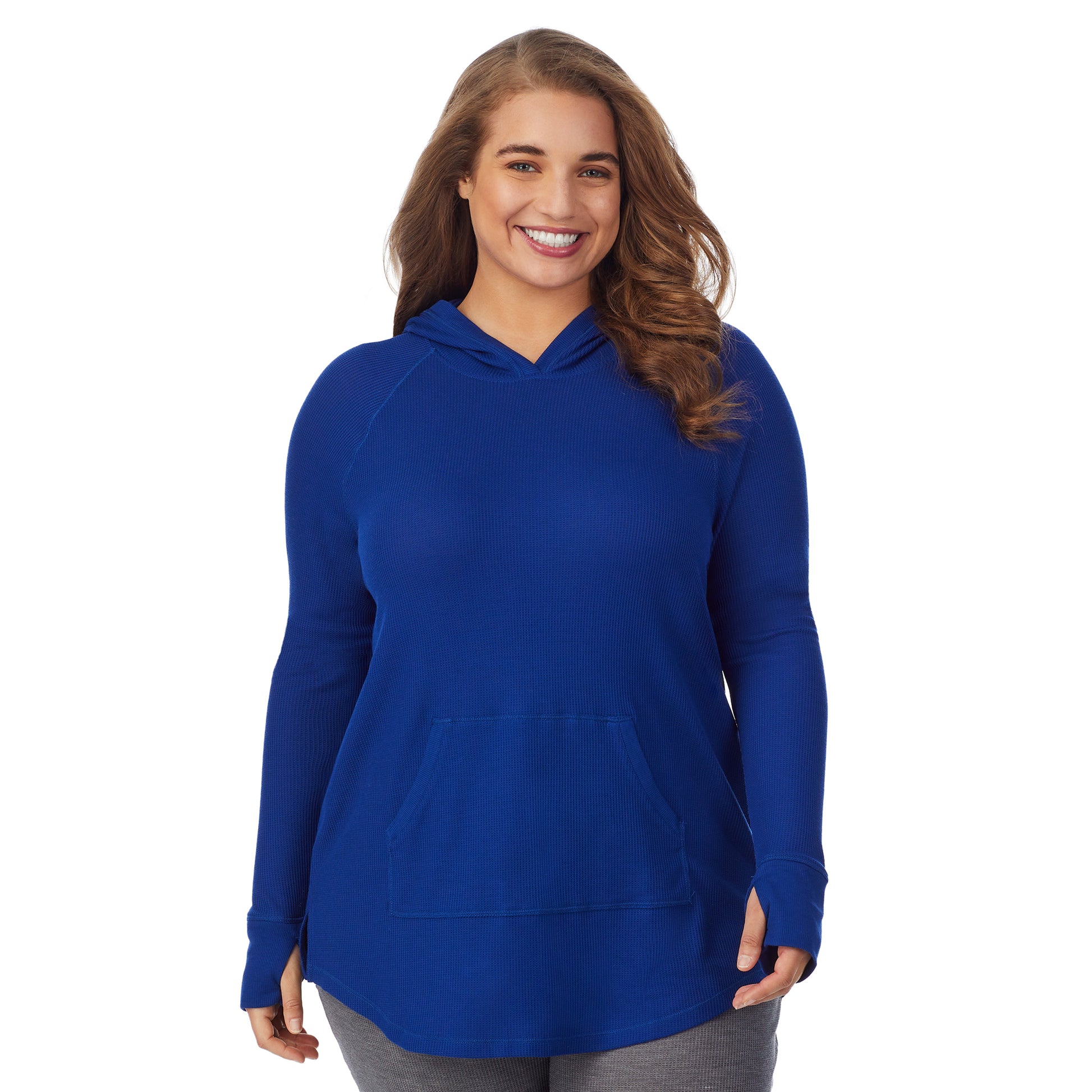 A lady wearing a royal blue long sleeve hoodie tunic plus.