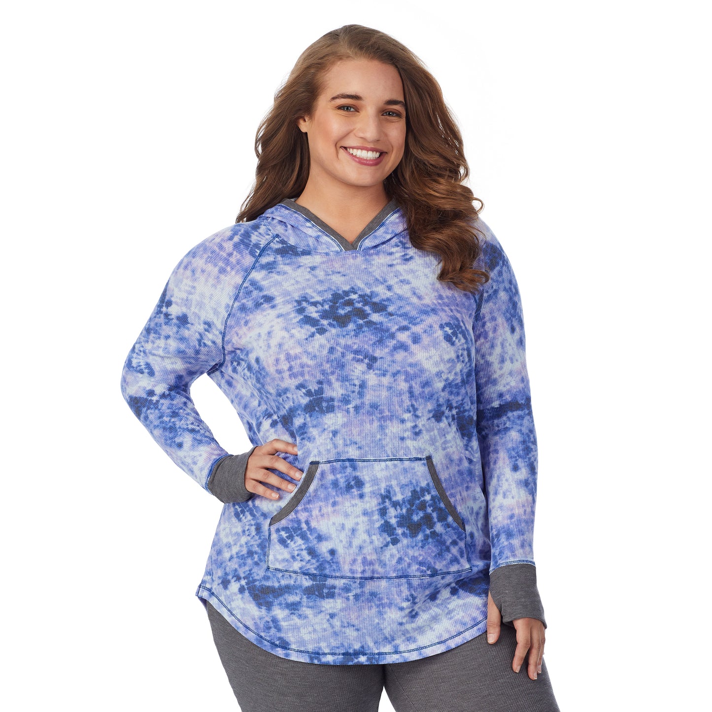 Blue Tie Dye; Model is wearing size 1X. She is 5'7", Bust 42.5", Waist 34.5", Hips 46". @A lady wearing a blue tie dye long sleeve hoodie tunic plus.