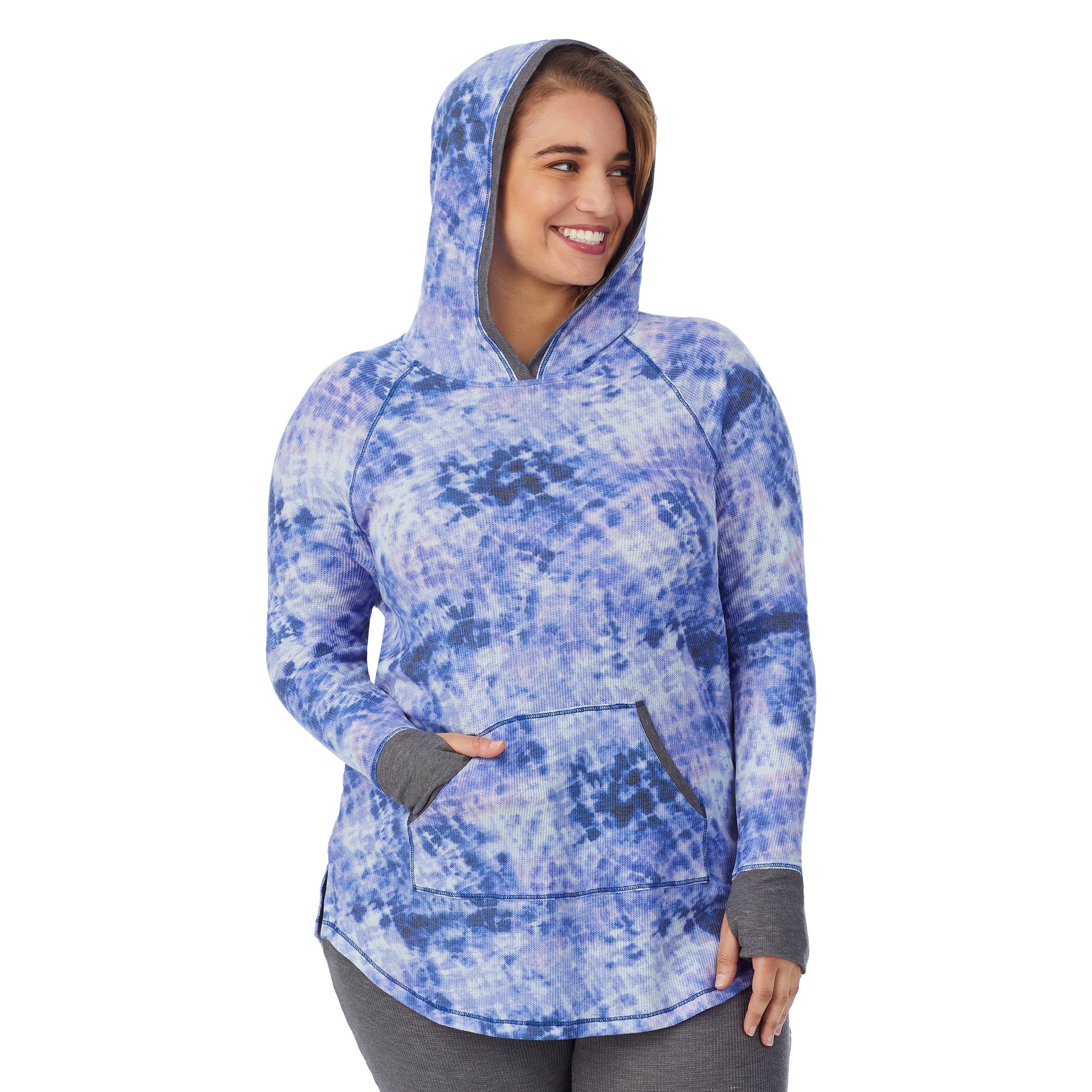 A lady wearing a blue tie dye long sleeve hoodie tunic plus.