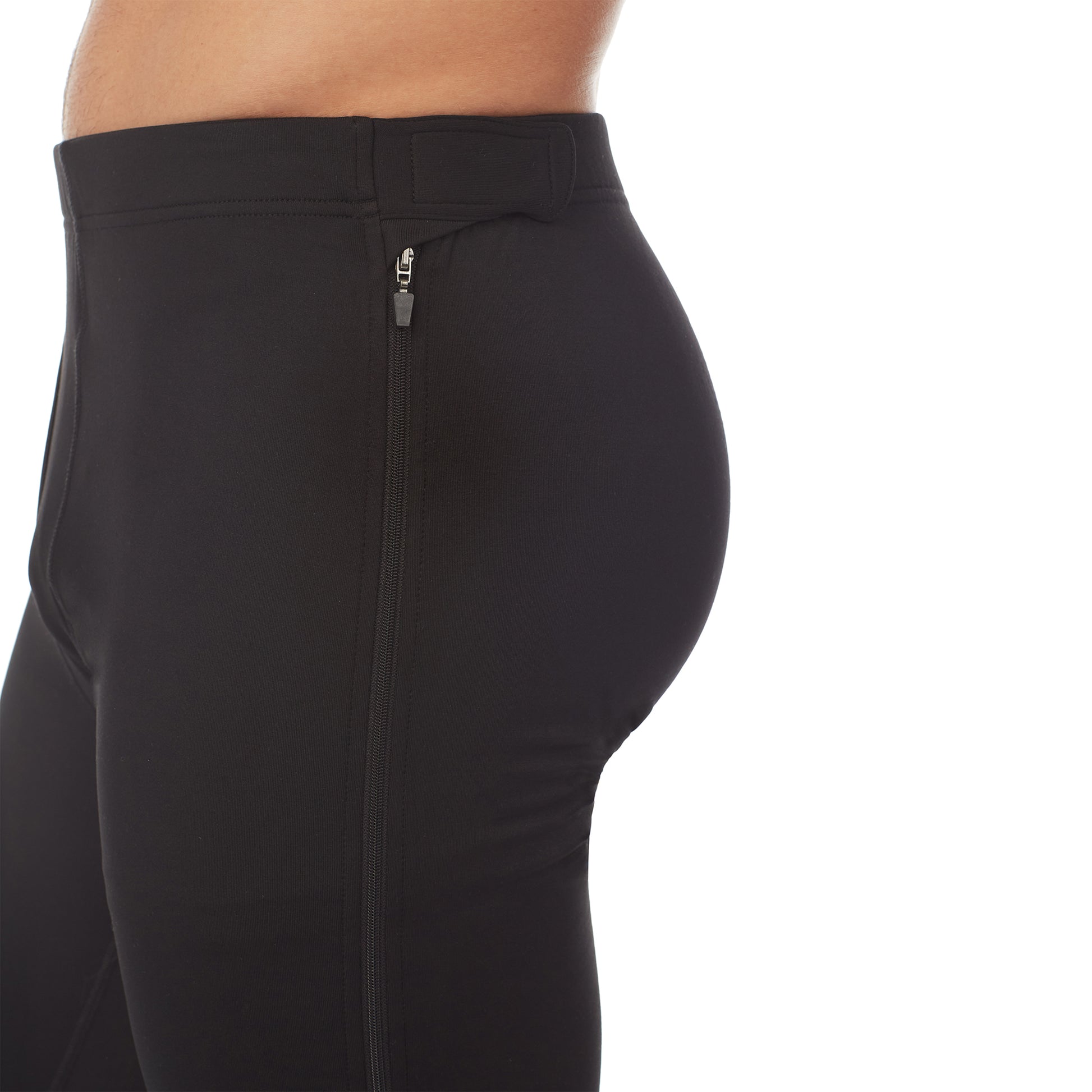 lower body of a man wearing black zip off pant