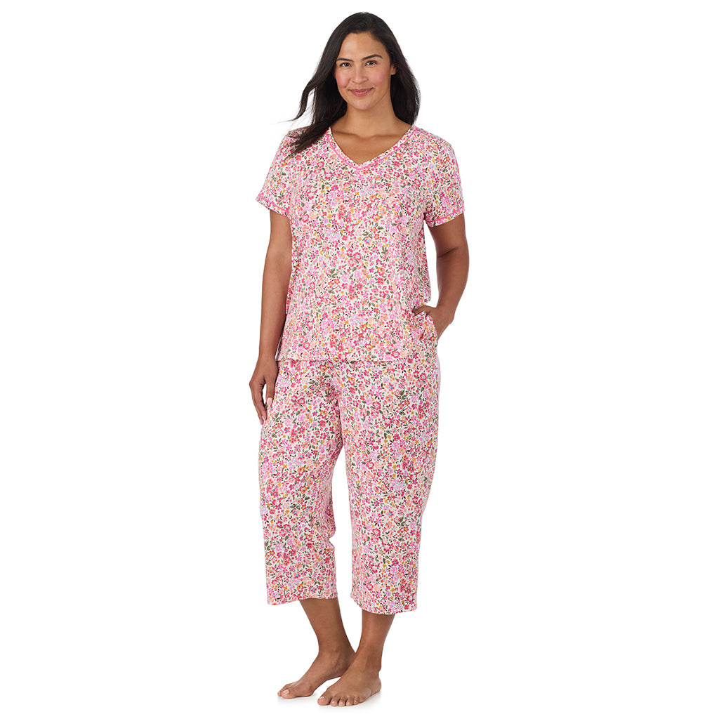 Floral Pink Ditsy; Model is wearing size 1X. She is 5'10", Bust 40", Waist 33", Hips 47". @A lady wearing Cotton-Blend Short Sleeve Top with Cropped Pant Pajama Set PLUS in Floral Pink Ditsy
