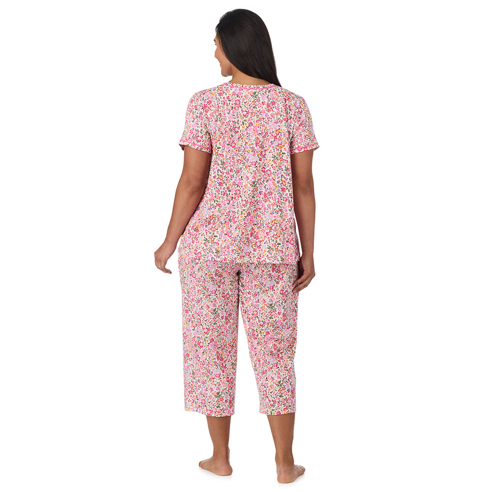 A lady wearing Cotton-Blend Short Sleeve Top with Cropped Pant Pajama Set PLUS in Floral Pink Ditsy back view