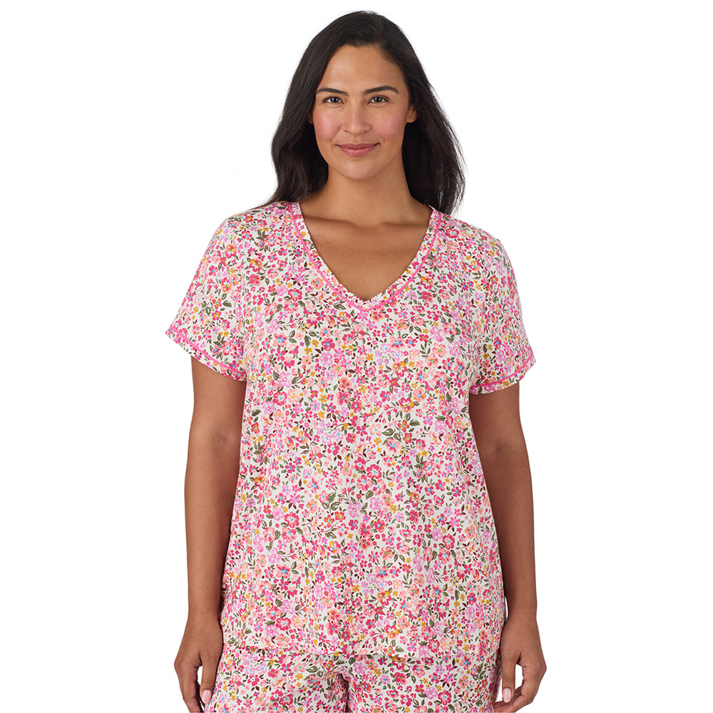 A lady wearing Cotton-Blend Short Sleeve Top with Cropped Pant Pajama Set PLUS in Floral Pink Ditsy closer look looking front