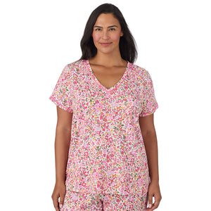 A lady wearing Cotton-Blend Short Sleeve Top with Cropped Pant Pajama Set PLUS in Floral Pink Ditsy closer look looking front