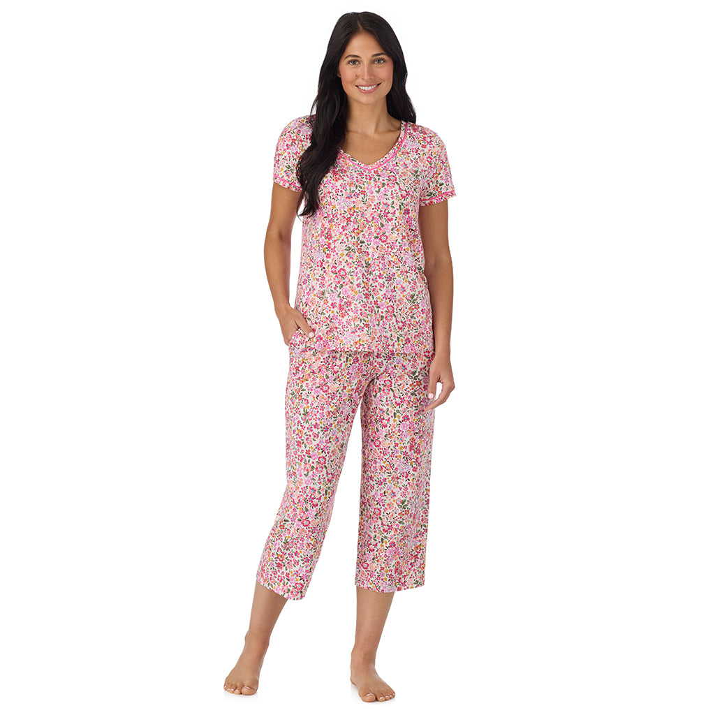 Floral Pink Ditsy; Model is wearing size S. She is 5'8.5", Bust 32", Waist 25", Hips 36". @A lady wearing Cotton-Blend Short Sleeve Top with Cropped Pant Pajama Set in Floral Pink Ditsy