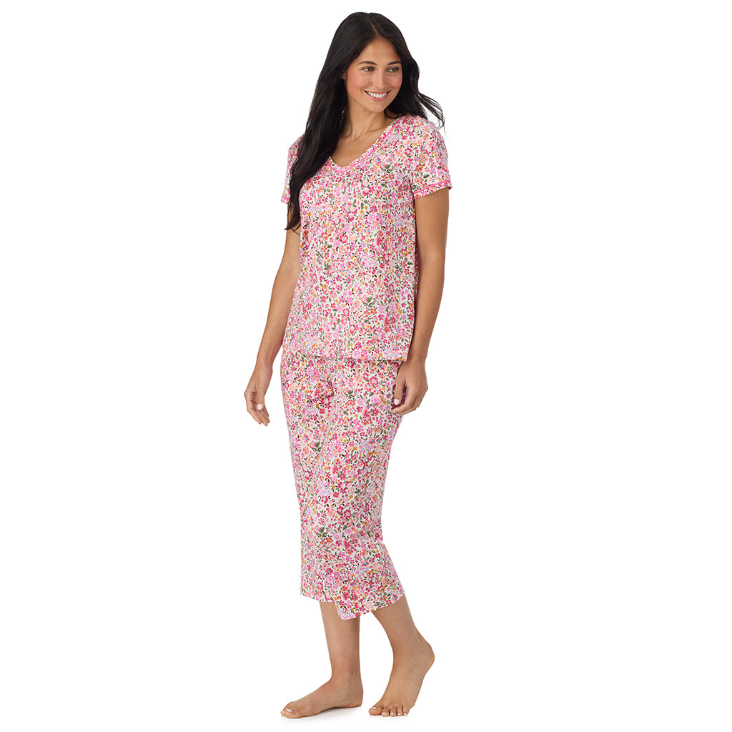 Floral Pink Ditsy; Model is wearing size S. She is 5'8.5", Bust 32", Waist 25", Hips 36". @A lady wearing Cotton-Blend Short Sleeve Top with Cropped Pant Pajama Set in Floral Pink Ditsy