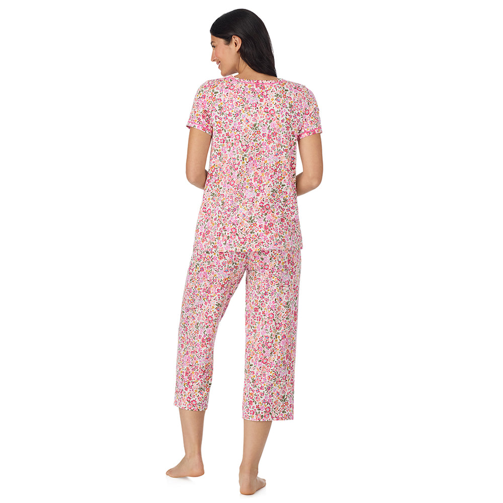 A lady wearing Cotton-Blend Short Sleeve Top with Cropped Pant Pajama Set in Floral Pink Ditsy back view