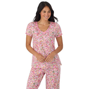 A lady wearing Cotton-Blend Short Sleeve Top with Cropped Pant Pajama Set in Floral Pink Ditsy closer look looking down