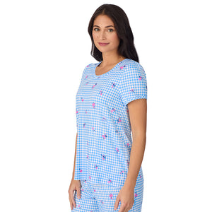 A lady wearing Cotton-Blend Short Sleeve Top with Cropped Pant 2-Pc Pajama Set in Ditsy Gingham