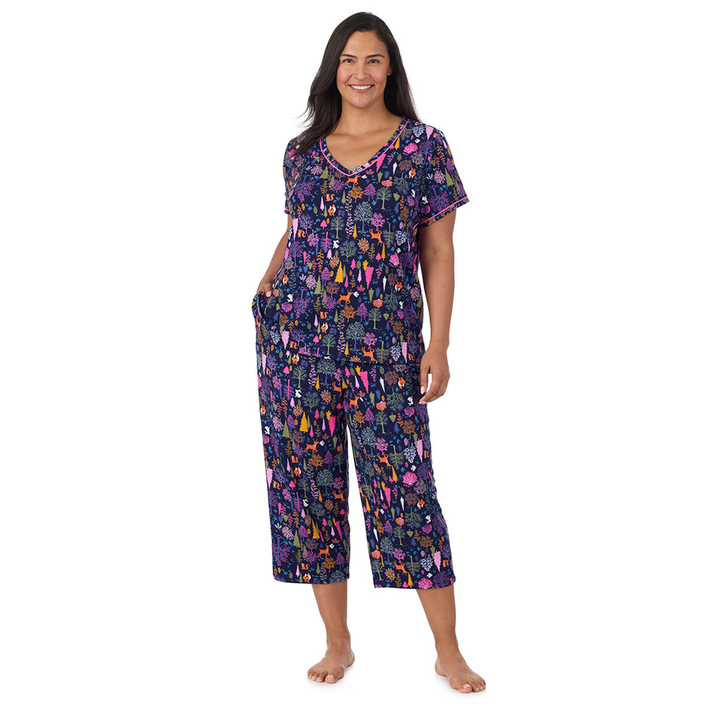 A lady wearing Cotton-Blend Short Sleeve Top with Cropped Pant Pajama Set PLUS in Navy Woodland
