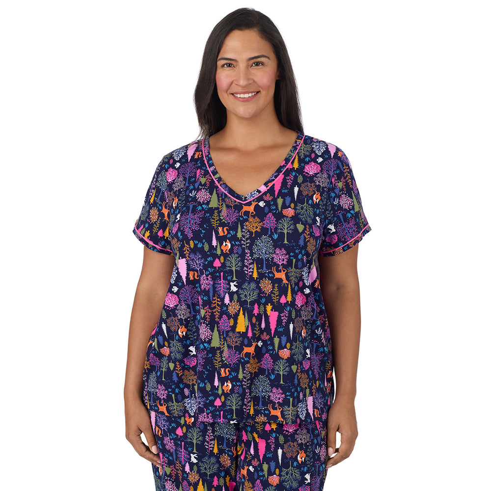 A lady wearing Cotton-Blend Short Sleeve Top with Cropped Pant Pajama Set PLUS in Navy Woodland closer look looking front