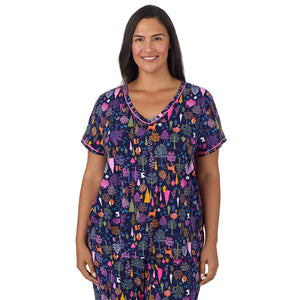 A lady wearing Cotton-Blend Short Sleeve Top with Cropped Pant Pajama Set PLUS in Navy Woodland closer look looking front