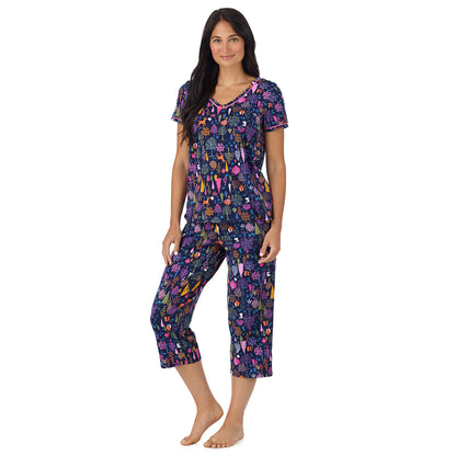 A lady wearing Cotton-Blend Short Sleeve Top with Cropped Pant Pajama Set Navy Woodland looking front