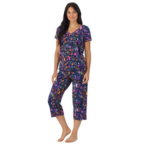 A lady wearing Cotton-Blend Short Sleeve Top with Cropped Pant Pajama Set in Navy Woodland