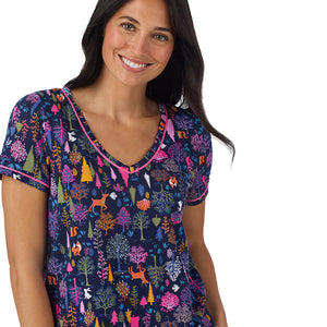 A lady wearing Cotton-Blend Short Sleeve Top with Cropped Pant Pajama Set in Navy Woodland back view