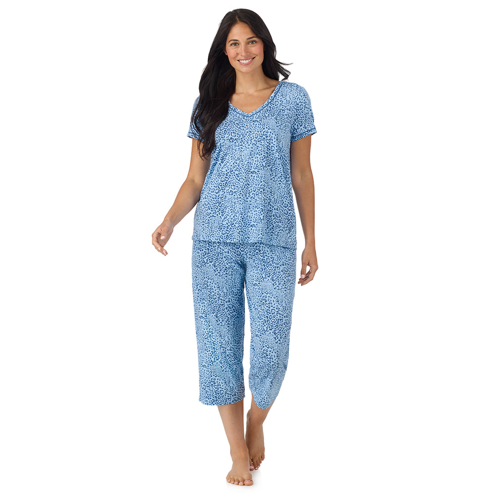 A lady wearing Cotton-Blend Short Sleeve Top with Cropped Pant Pajama Set in Blue Animal
