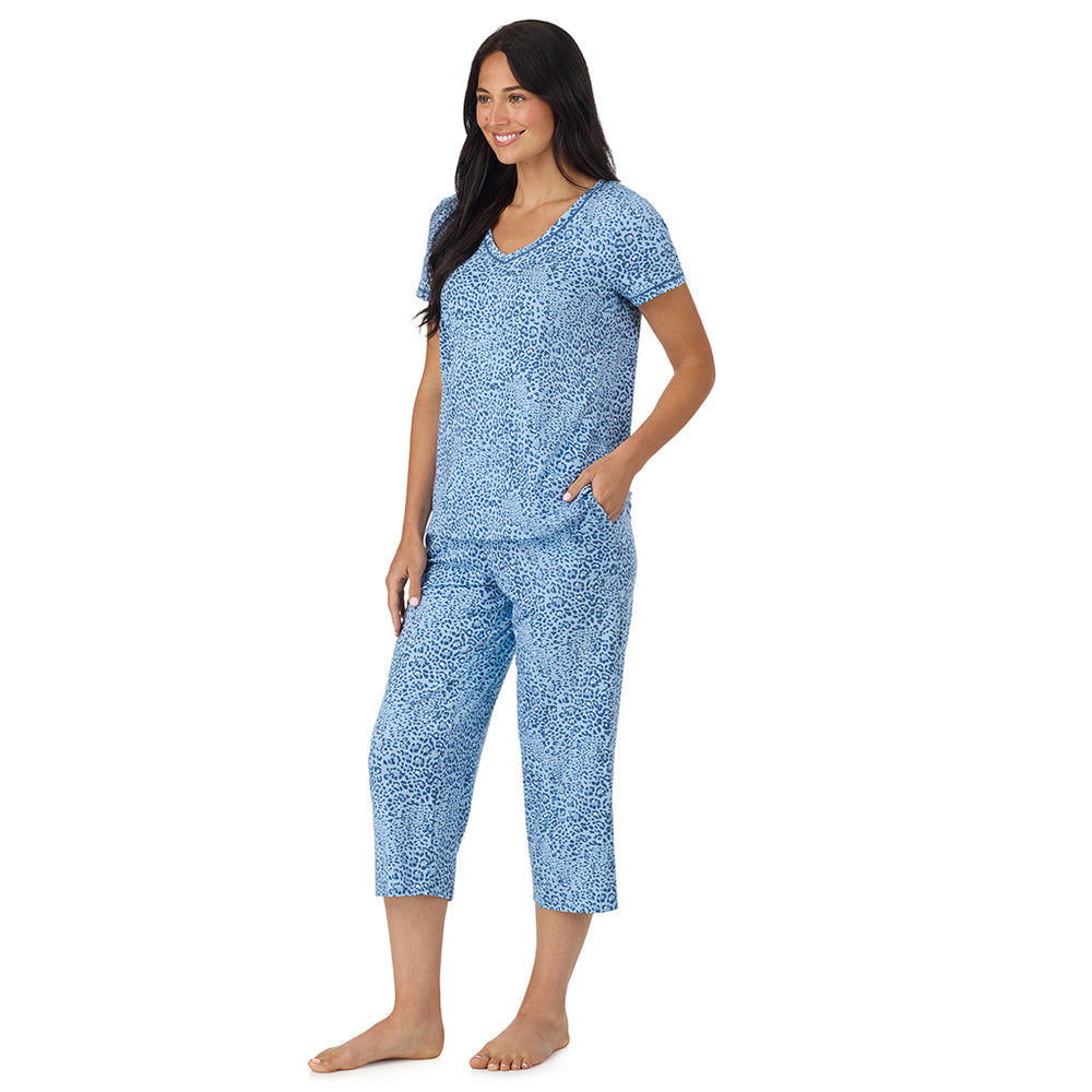 A lady wearing Cotton-Blend Short Sleeve Top with Cropped Pant Pajama Set in Blue Animal looking side