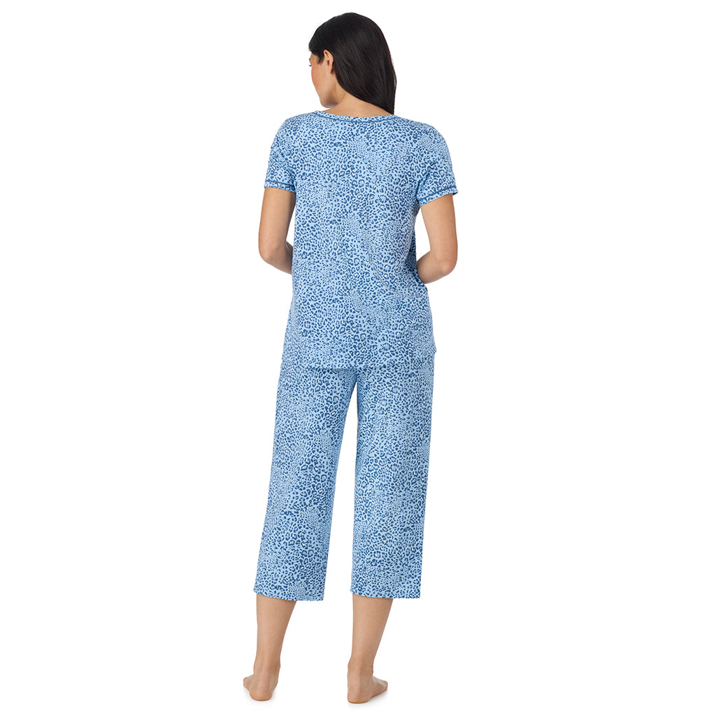 A lady wearing Cotton-Blend Short Sleeve Top with Cropped Pant Pajama Set Blue Animal back view