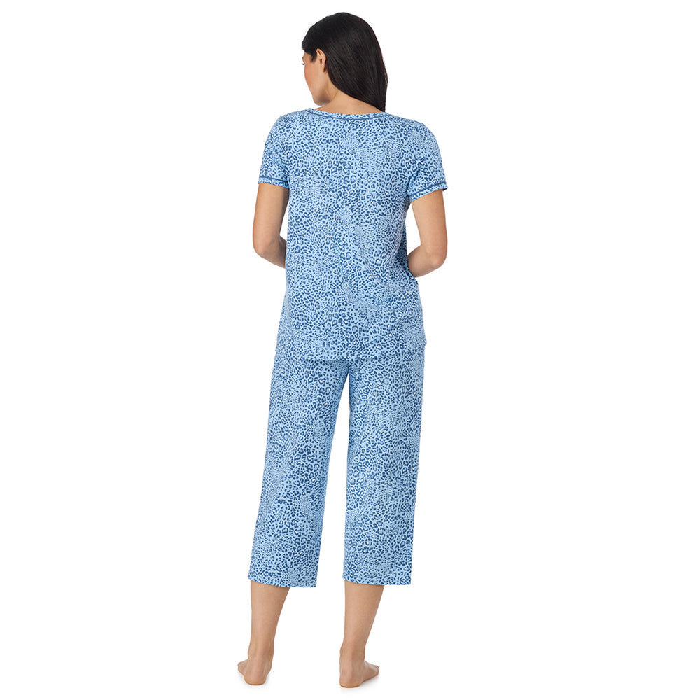 A lady wearing Cotton-Blend Short Sleeve Top with Cropped Pant Pajama Set in Blue Animal back view