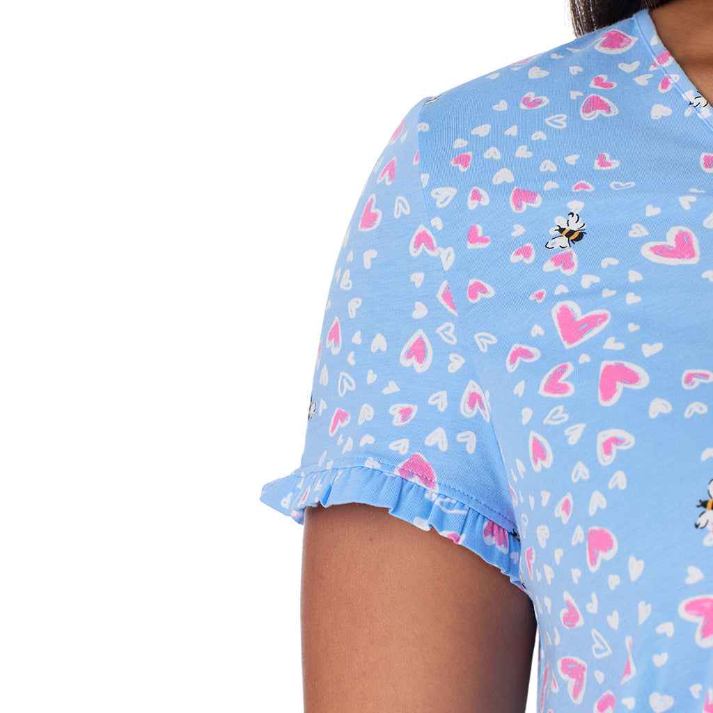 Blue Bee Heart;Model is wearing size 1X. She is 5'10", Bust 40", Waist 33", Hips 47".@A lady wearing Cotton Rich Ruffled Short Sleeve Top with Pant Pajama Set PLUS