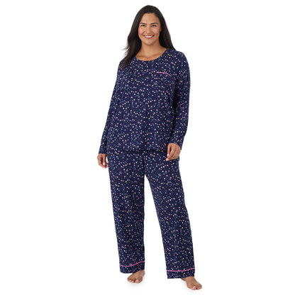 A lady wearing plus size Cotton-Blend Long Sleeve Top and Long Pant Pajama Set PLUS Navy Star Print