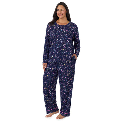 A lady wearing plus size Cotton-Blend Long Sleeve Top and Long Pant Pajama Set PLUS Navy Star Print looking side