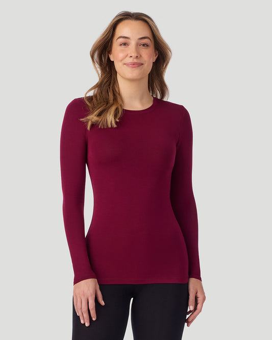 A lady wearing a Bordeaux Plaid long sleeve stretch crew back view