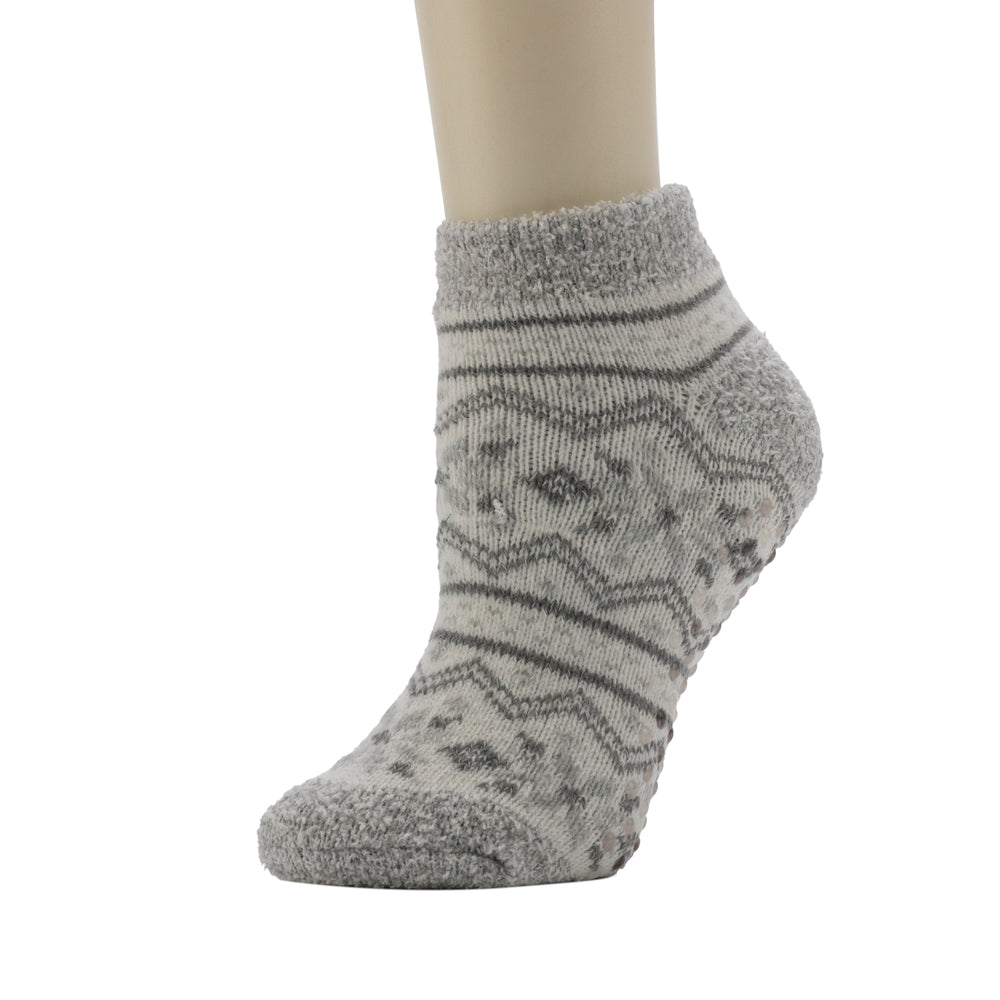 A mannequin wearing Snowflake Fairisle Cozy Lined Low Cut Slipper Sock