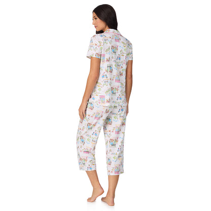 A lady wearing Cotton-Blend Short Sleeve Notch Collar with Cropped Pant 2-Pc Pajama Set in Spring Scene
