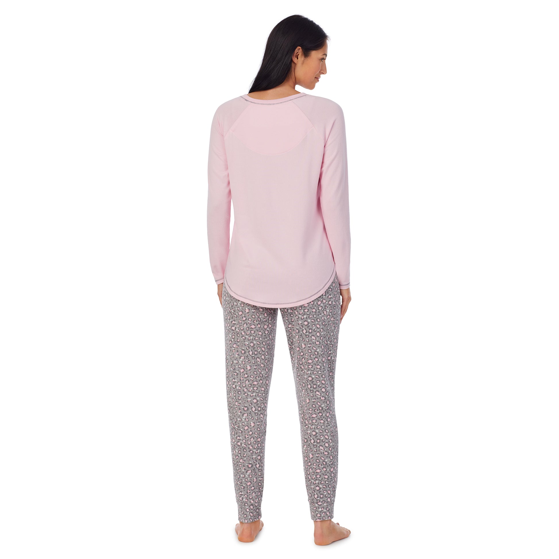 A lady wearing Brushed Sweater Knit Long Sleeve Pajama Set with animal print bottom and pink top