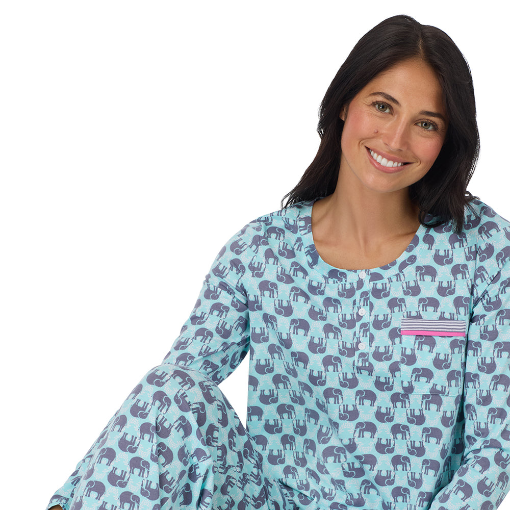 A lady wearing Cotton-Blend Long Sleeve Top and Long Pant Pajama Set in Elephant sitting down