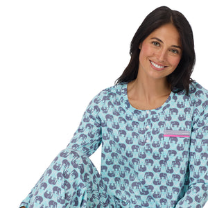 A lady wearing Cotton-Blend Long Sleeve Top and Long Pant Pajama Set in Elephant sitting down