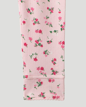 A Pink Ditsy Floral Girls Pointelle Knit 2 pc. Long Sleeve Crew & Pant Set featured in a detail close up shot of the sleeve hem