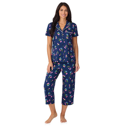 A lady wearing Cotton-Blend Short Sleeve Notch Collar with Cropped Pant 2-Pc Pajama Set in Navy Cherry Bow