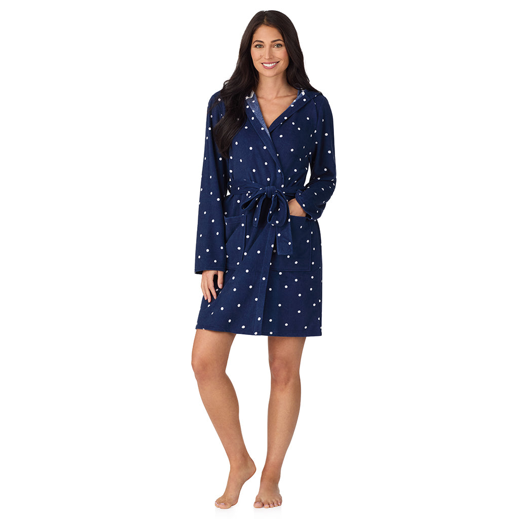 A lady wearing Vintage Terry Wrap Robe with Hood in Navy Dot