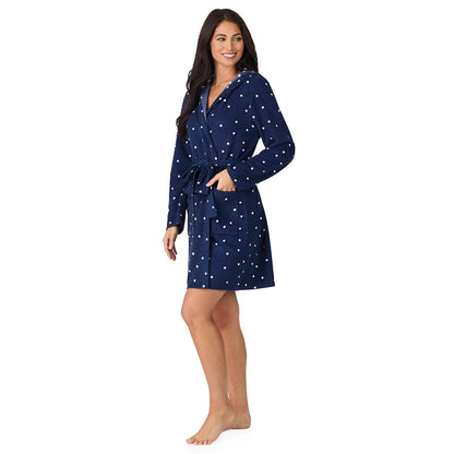A lady wearing Vintage Terry Wrap Robe with Hood in Navy Dot