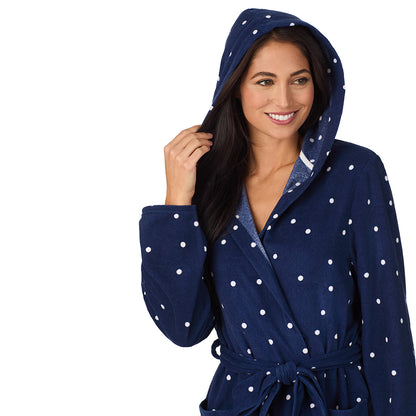 A lady wearing Vintage Terry Wrap Robe with Hood in Navy Dot