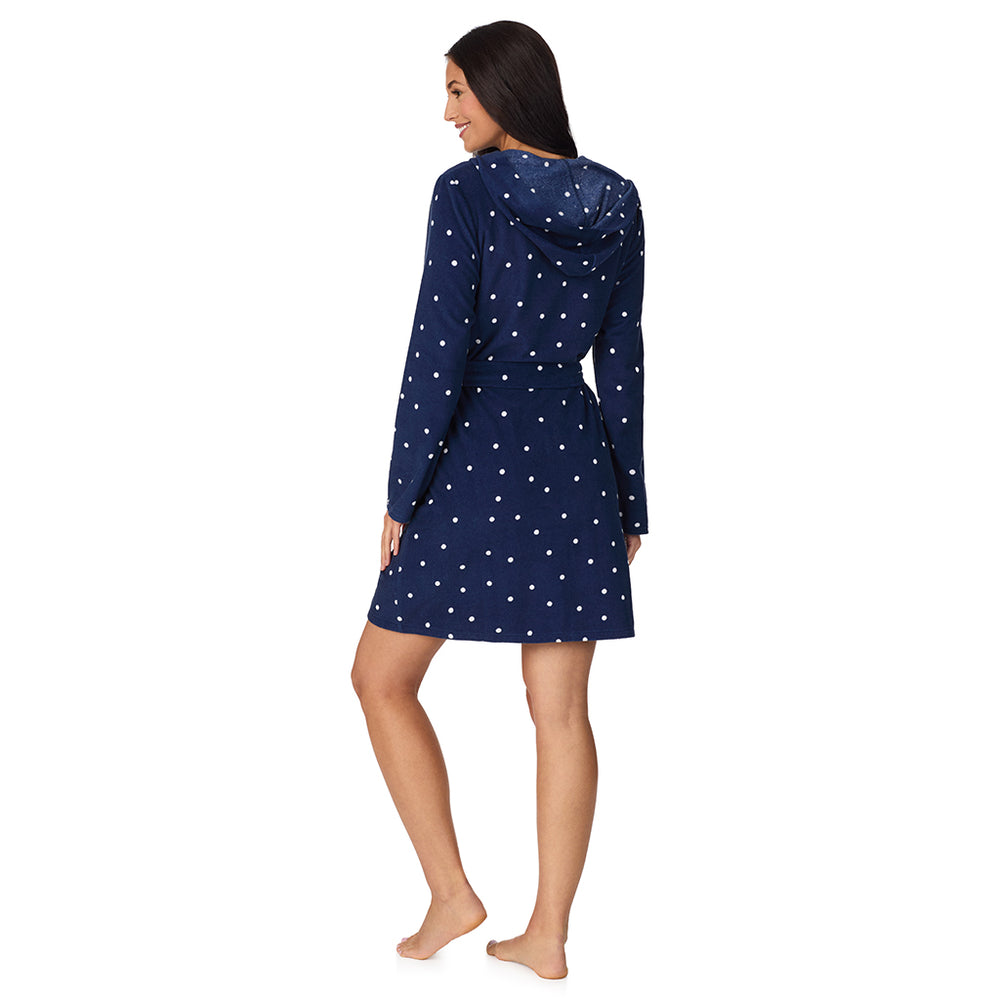 A lady wearing Vintage Terry Wrap Robe with Hood in Navy Dot
