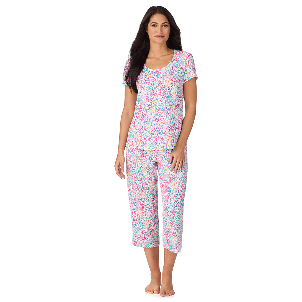 Ditsy Floral Print; Model is wearing size S. She is 5'8.5", Bust 32", Waist 25", Hips 36". @A lady wearing Cotton-Blend Short Sleeve Top with Cropped Pant with Scallop Detail 2-Pc Pajama Set in Ditsy Floral Print