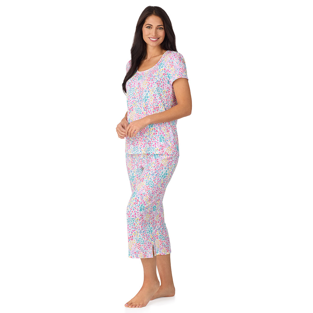 Ditsy Floral Print; Model is wearing size S. She is 5'8.5", Bust 32", Waist 25", Hips 36". @A lady wearing Cotton-Blend Short Sleeve Top with Cropped Pant with Scallop Detail 2-Pc Pajama Set in Ditsy Floral Print