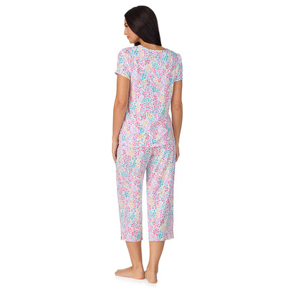 A lady wearing Cotton-Blend Short Sleeve Top with Cropped Pant with Scallop Detail 2-Pc Pajama Set in Ditsy Floral Print
