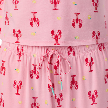  A lady wearing Cotton-Blend Short Sleeve Top and Cropped Pant Pajama Set in Lobster posing close up detail view pose