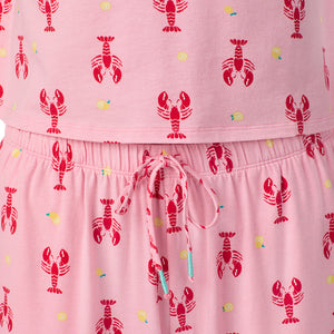  A lady wearing Cotton-Blend Short Sleeve Top and Cropped Pant Pajama Set in Lobster posing close up detail view pose