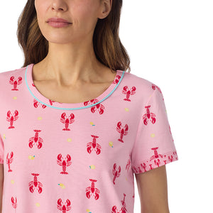  A lady wearing Cotton-Blend Short Sleeve Top and Cropped Pant Pajama Set in Lobster posing straight close up view pose