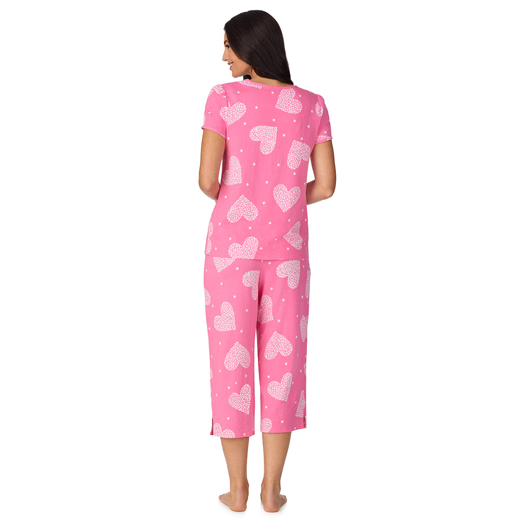 A lady wearing Cotton-Blend Short Sleeve Top with Cropped Pant with Scallop Detail 2-Pc Pajama Set in Ditsy Floral Print