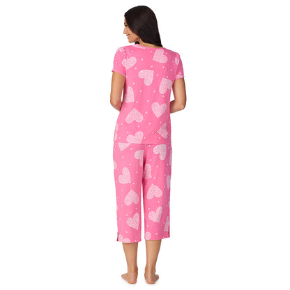A lady wearing Cotton-Blend Short Sleeve Top with Cropped Pant with Scallop Detail 2-Pc Pajama Set in Ditsy Floral Print