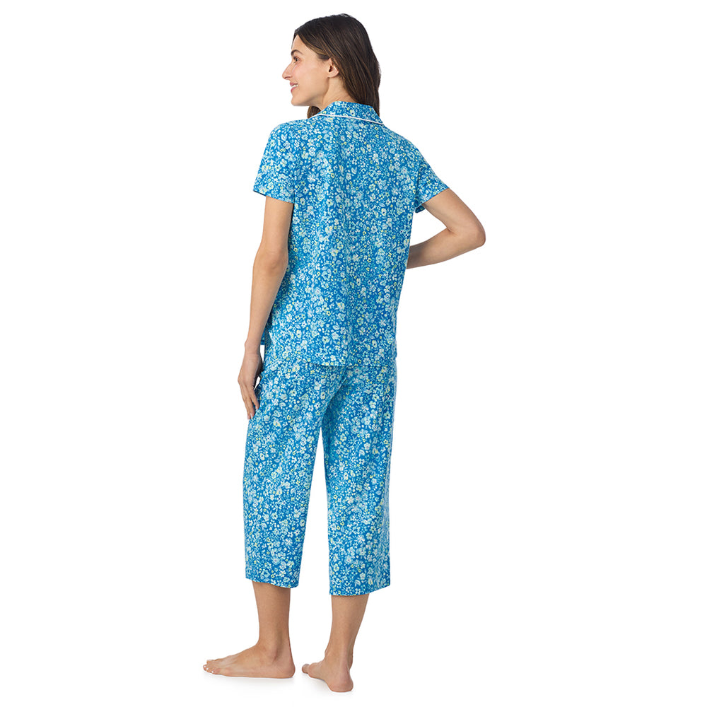 A lady wearing Cotton-Blend Short Sleeve Notch Collar with Cropped Pant Pajama Set in Blue Ditsy posing back view pose