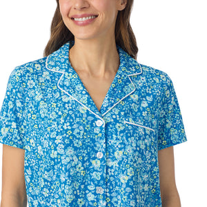  A lady wearing Cotton-Blend Short Sleeve Notch Collar with Cropped Pant Pajama Set in Blue Ditsy posing close up view pose