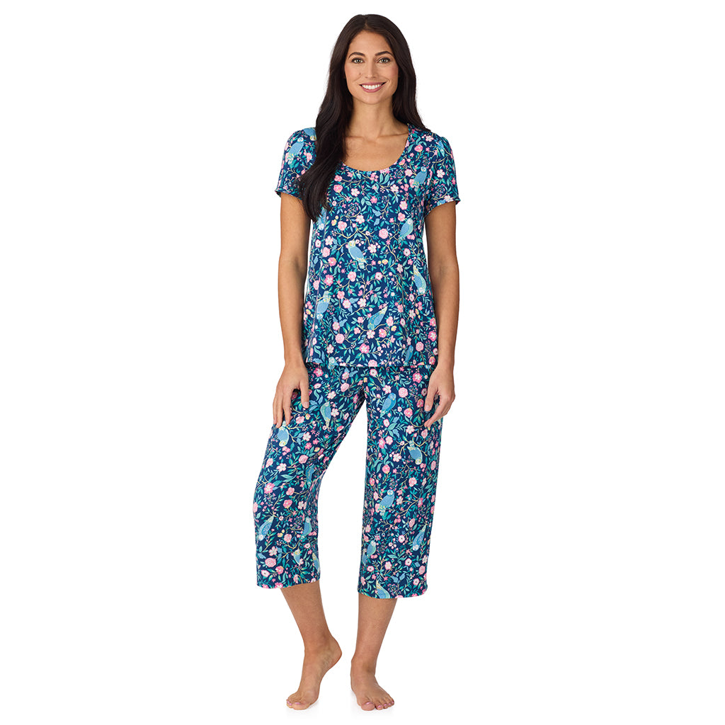 A lady wearing Cotton-Blend Short Sleeve Top with Cropped Pant with Scallop Detail 2-Pc Pajama Set in Dark Blue Owl